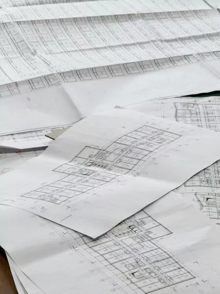 Architectural blueprints spread out on a surface