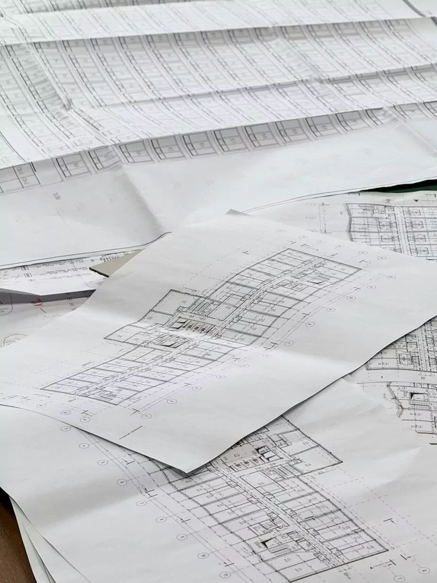 Architectural blueprints spread out on a surface